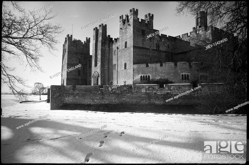 Stock Photo: An exterior view of Raby Castle, showing the east elevation from the south-east, with a low curtain wall in the foreground.