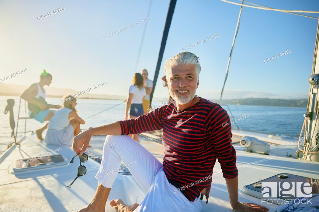 Imagen: Portrait smiling man relaxing on sunny boat.