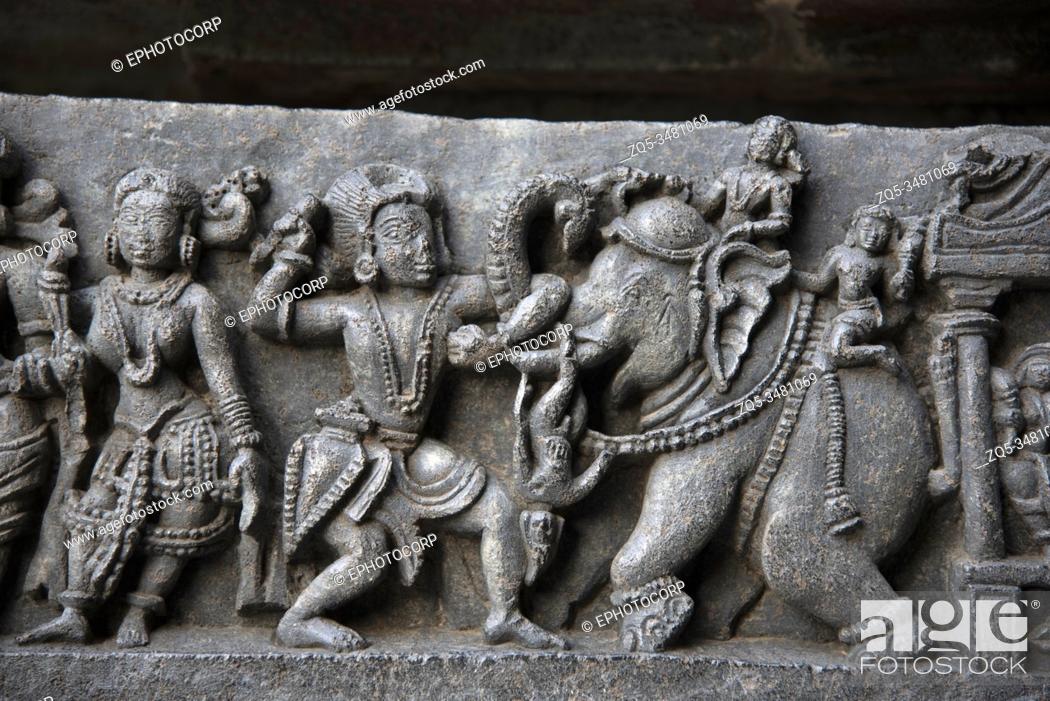 Stock Photo: Carved idols on the outer wall of Hoysaleswara temple, Hoysaleswara Shiva temple, Halebidu, Karnataka, India.