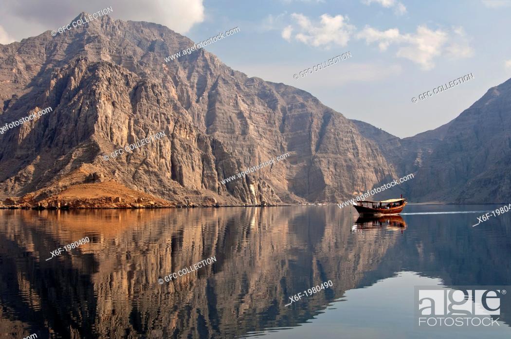 Stock Photo: Traditional dhow sailboat moored in a bay during a cruise in the Khor Ash Sham Fjord, Musandam, Sultanate of Oman.