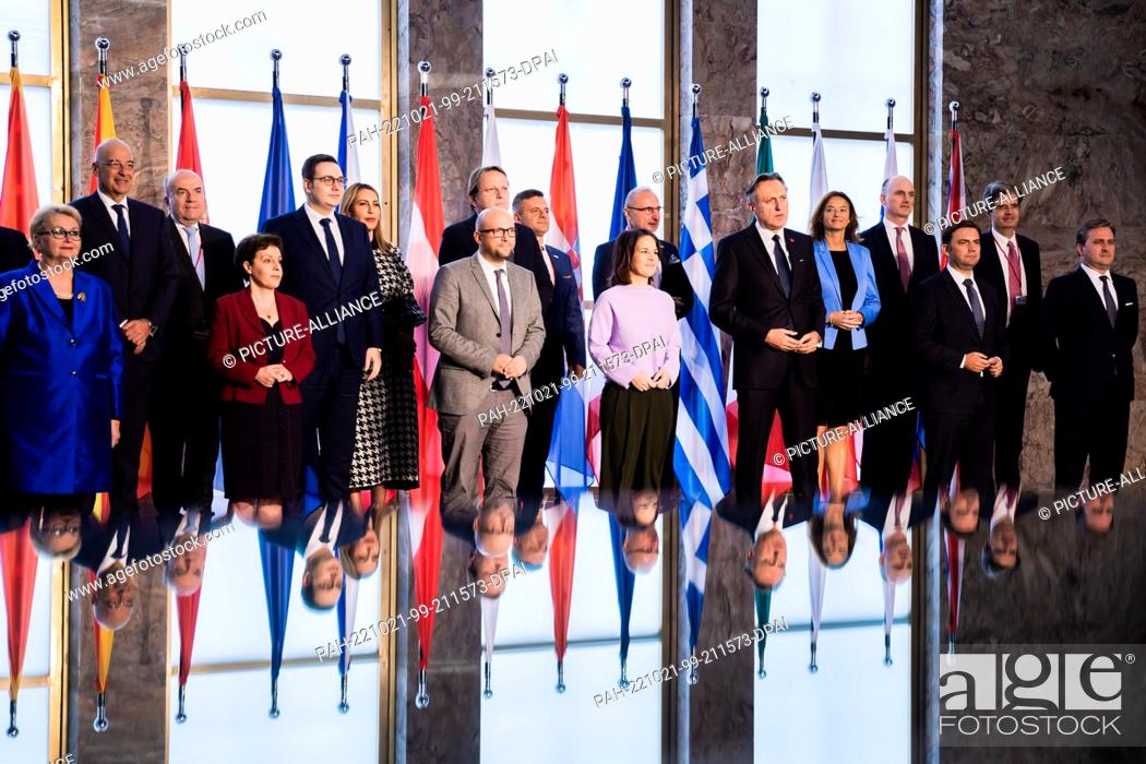 Stock Photo: 21 October 2022, Berlin: Annalena Baerbock (Bündnis 90/Die Grünen (M in purple), Foreign Minister, stands with counterparts and other representatives for a.