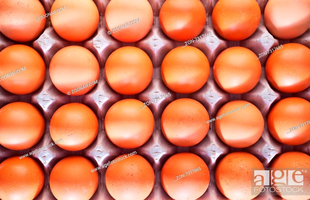 Stock Photo: raw brown egg, chicken eggs on a table.