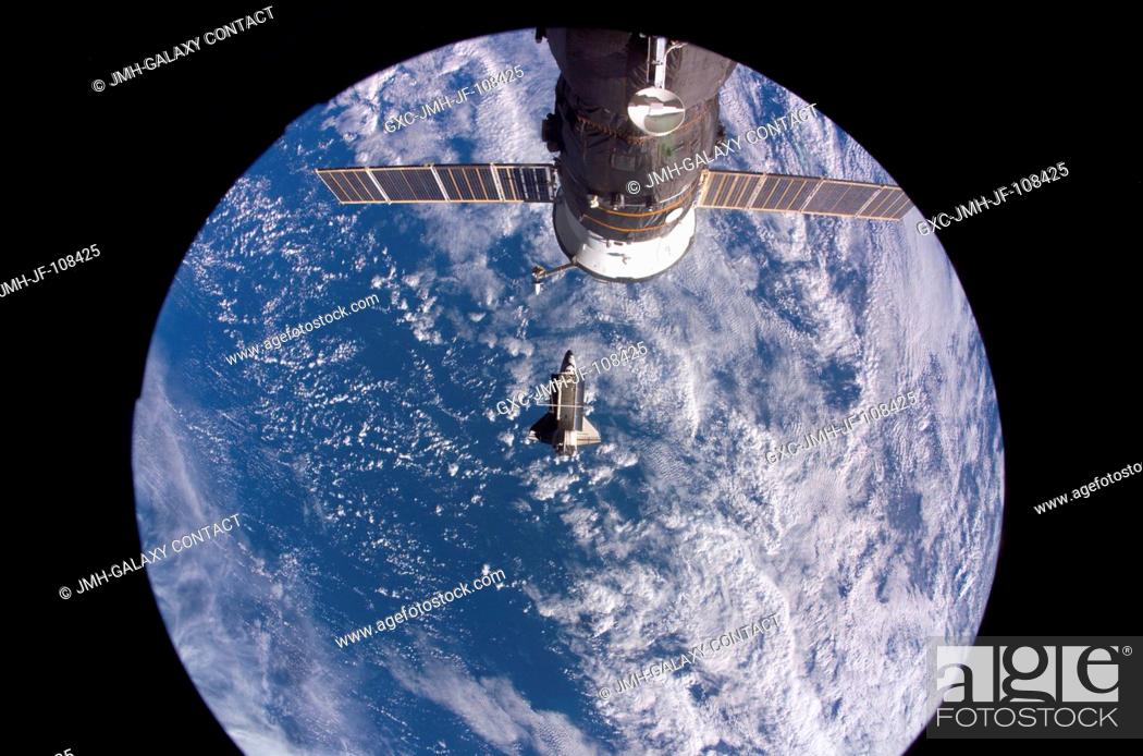 Stock Photo: Backdropped by a blue and white Earth, Space Shuttle Discovery is featured in this image photographed by an Expedition 16 crewmember after the shuttle undocked.