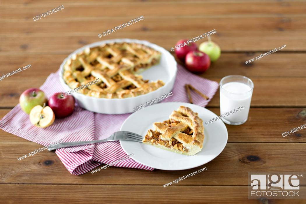 Stock Photo: close up of apple pie and fork on plate.