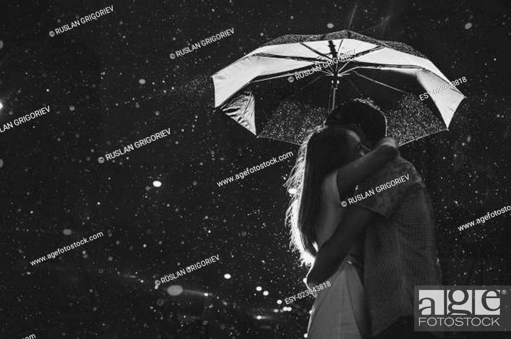 Love in the rain / Silhouette of kissing couple under umbrella, Stock  Photo, Picture And Low Budget Royalty Free Image. Pic. ESY-023043818 |  agefotostock