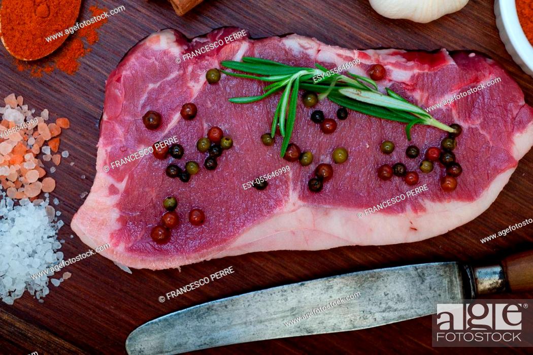 Stock Photo: raw uncooked ribeye beef steak butcher selection.