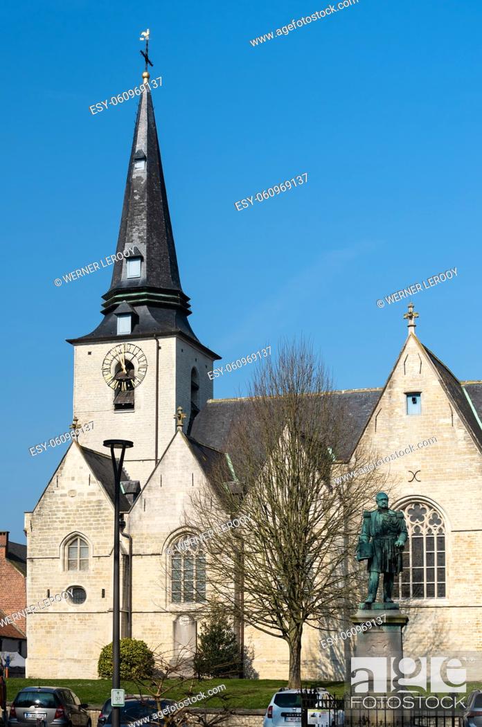 Stock Photo: Meise, Flemish Brabant Region, Belgium The catholic church tower of the village over a blue sky.