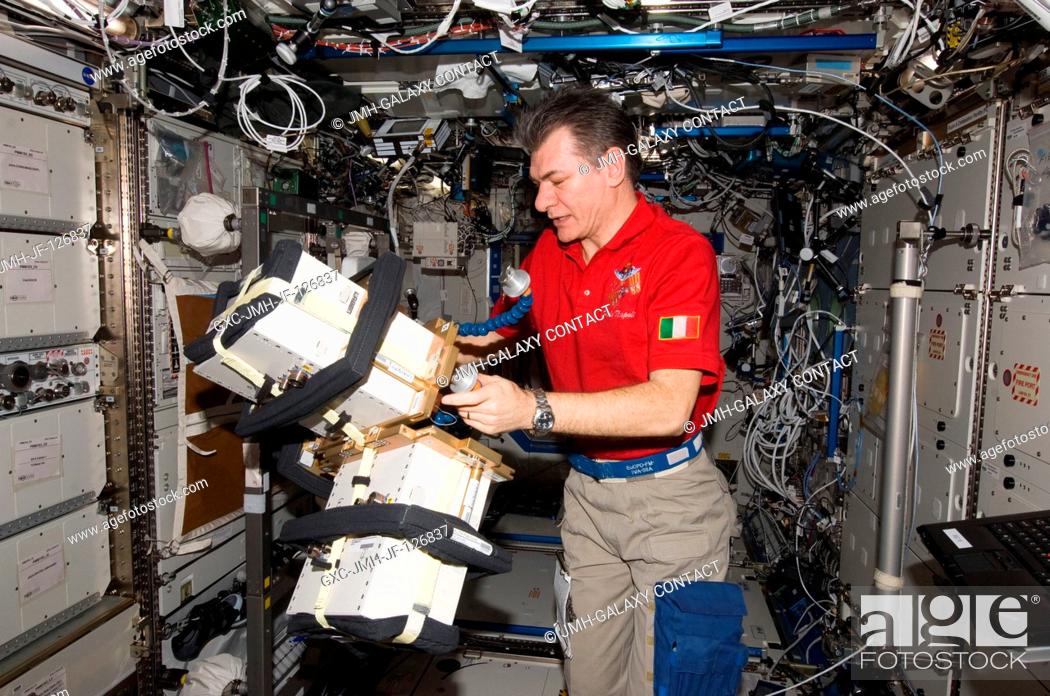Stock Photo: European Space Agency astronaut Paolo Nespoli, Expedition 27 flight engineer, works with Anomalous Long Term Effects on Astronauts (ALTEA) Shield isotropic.