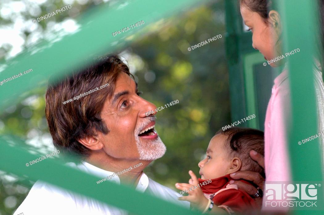 Stock Photo: South Asian Indian Bollywood actor Amitabh Bachchan with a child promoting polio drops NO MR.