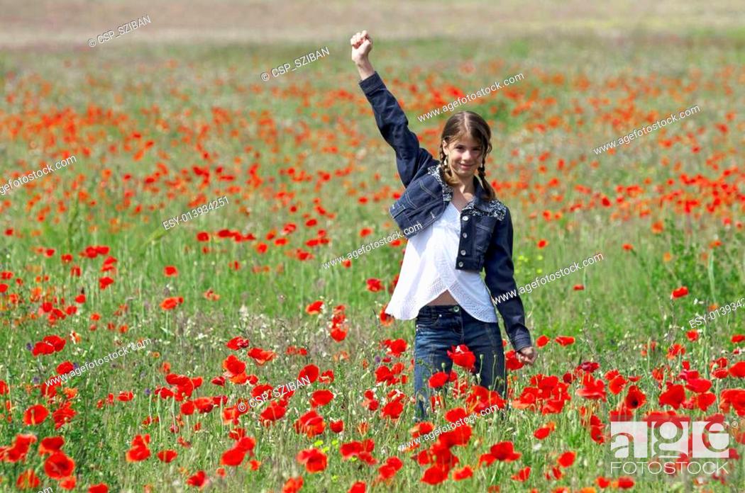 Stock Photo: Girl with poppies happy.