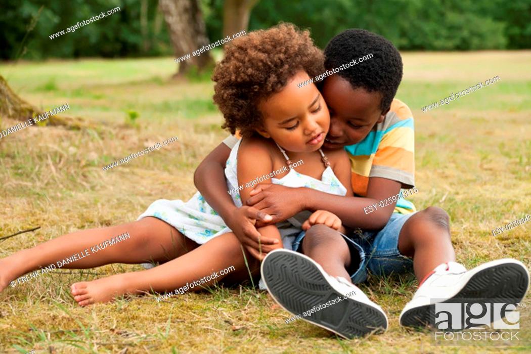 Photo de stock: african brother and sister having fun in nature.