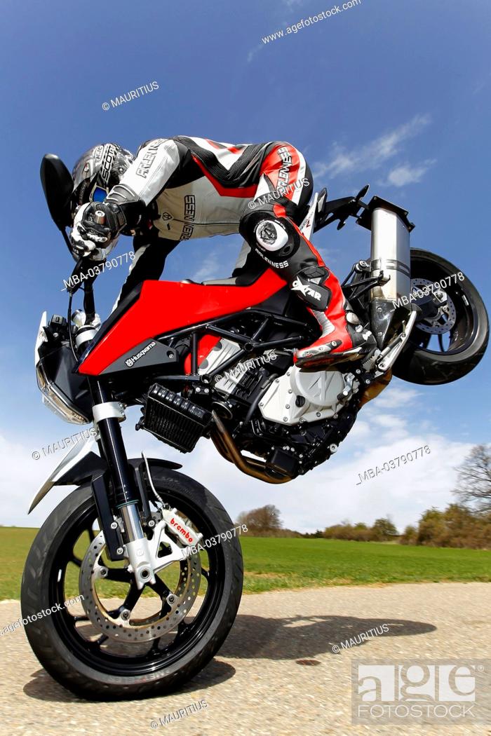 Stock Photo: Motorcycle, Husqvarna Nuda 900 R, year of construction in 2012, Stoppie on country road,.