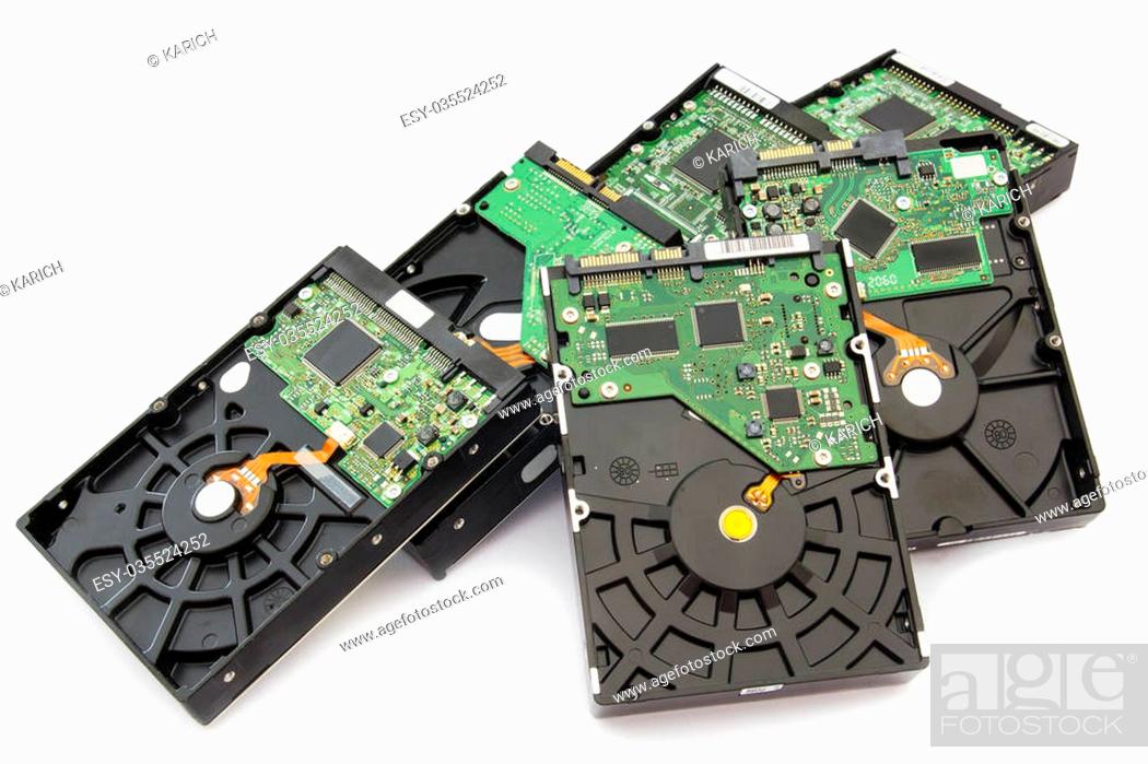 Stock Photo: Stack of Old SATA and ATA Hard Disk Drives. Isolated on White Background.