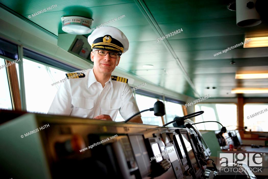 Stock Photo: Elmar Muehlebach, captain of the cruise ship 'Deutschland, ' stands on the Deutschland's bridge at the cruise ship in the port of Hamburg, Germany, 02 May 2013.