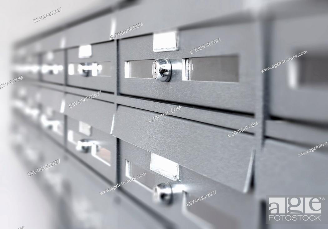 Stock Photo: Aluminum mail boxes. Ideal for concepts such as safety and security, business communication and more. Shallow DOF.