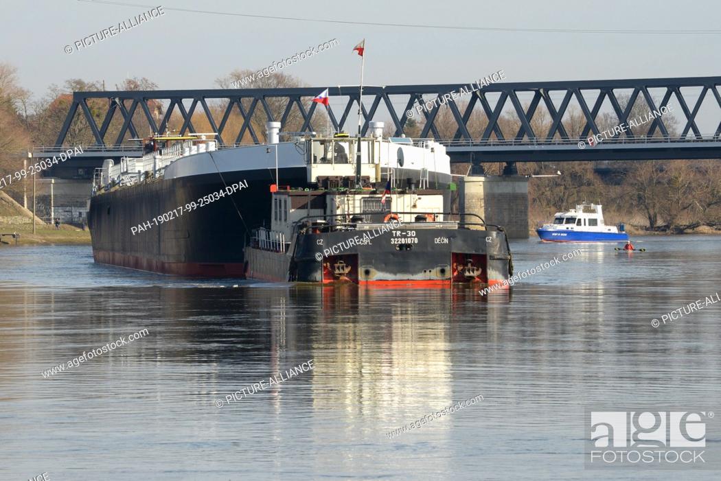 Stock Photo: 17 February 2019, Saxony-Anhalt, Dessau-Roßlau: The newly built hull of an inland tanker named ""Spera"" of the Czech shipping company CSPL is being transported.