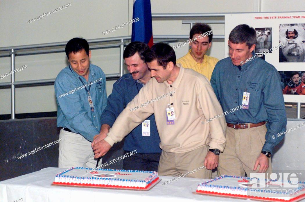 Stock Photo: The Expedition Seven crewmembers are photographed during a cake-cutting ceremony in the Jake Garn Simulation and Training Facility at the Johnson Space Center.