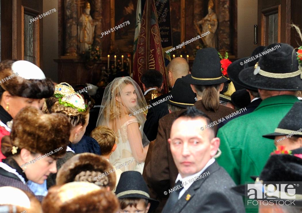 Stock Photo: Princess Maria Theresia von Thurn und Taxis (C) is being escorted by her brother Albert to the wedding altar at the church of Saint Joseph in Tutzingen, Germany.