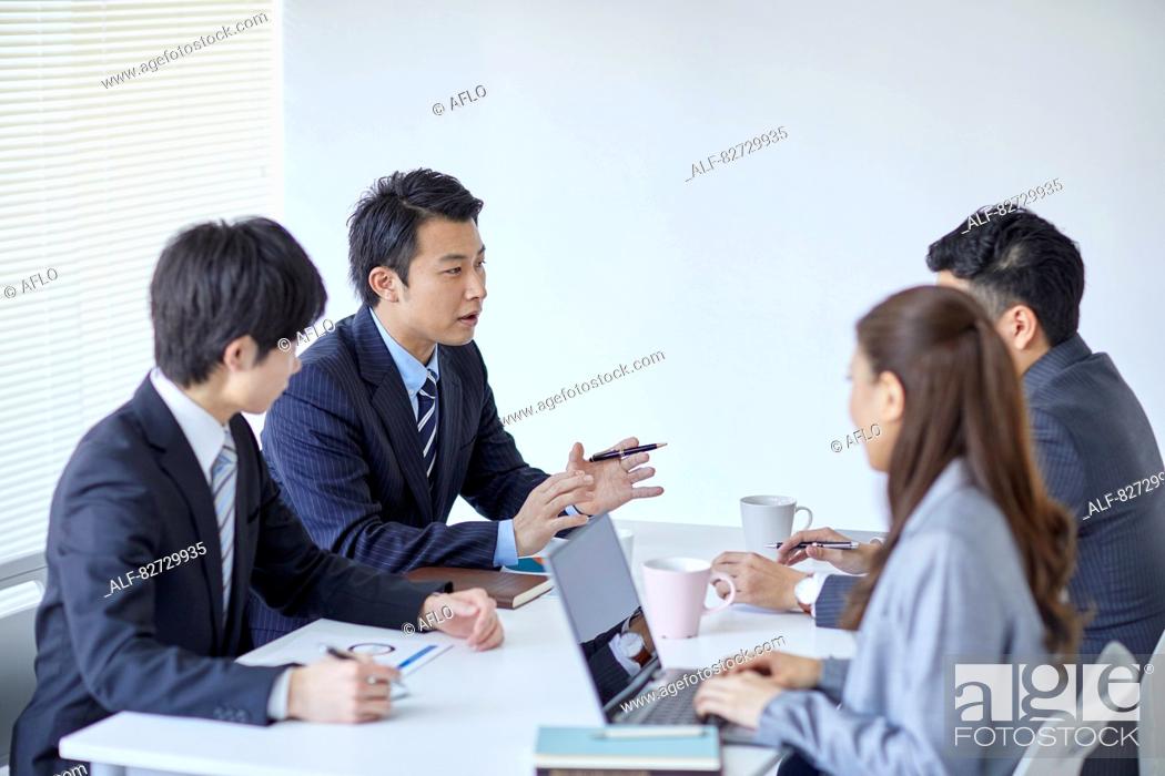 Stock Photo: Japanese businesspeople in a meeting.