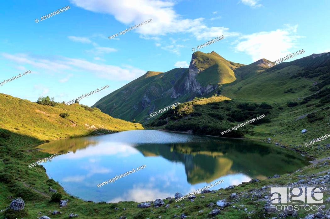 Stock Photo: Mountain Schochenspitze with reflection in lake.