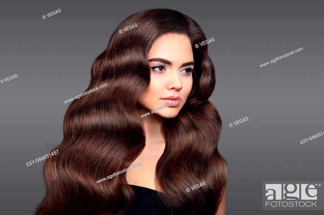 Healthy hair. Beautiful Brunette girl portrait with long shiny wavy hair,  Stock Photo, Picture And Low Budget Royalty Free Image. Pic. ESY-046851457  | agefotostock