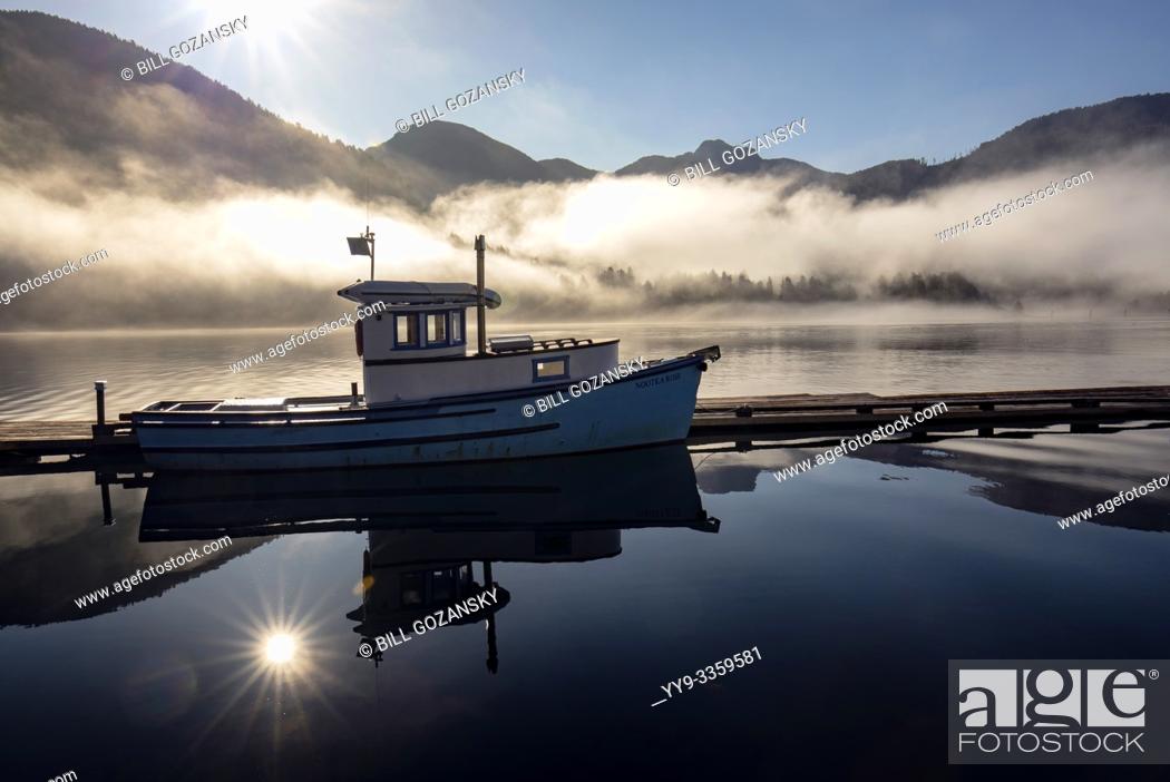 Stock Photo: Fishing boat reflections at sunrise - Westview Marina in Tahsis, near Gold River, Vancouver Island, British Columiba, Canada.