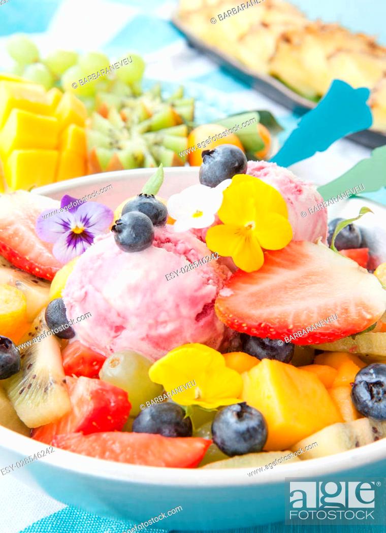 Stock Photo: Fresh fruit salad with scoops of cherry ice cream.