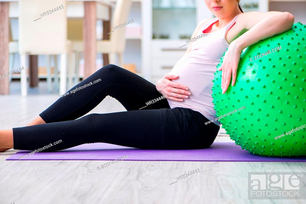 Stock Photo: Pregnant woman exercising in anticipation of child birth.