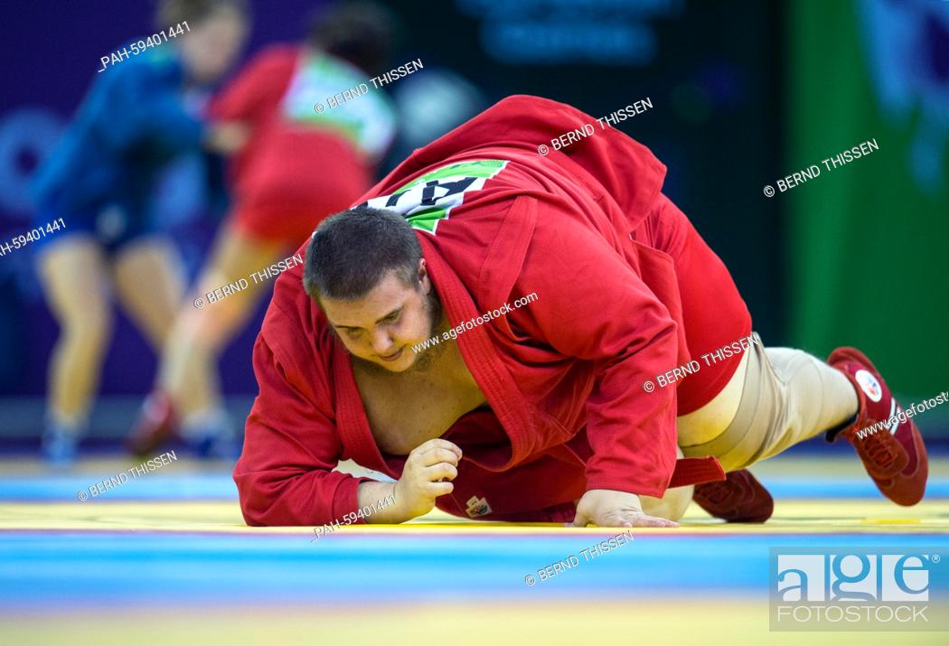 Stock Photo: Kevin Rasit Cekic of Austria competes with Tonoyan from Ukraine in the Sambo - Men's +100kg Quarterfinal at the Baku 2015 European Games in Heydar Aliyev Arena.