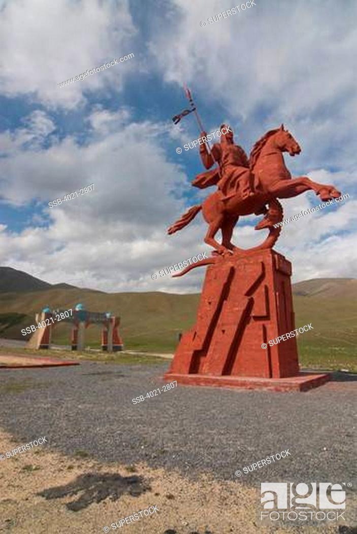 Stock Photo: Kyrgyzstan, between Sary Chelek and Bishkek, Statue of a horseman.