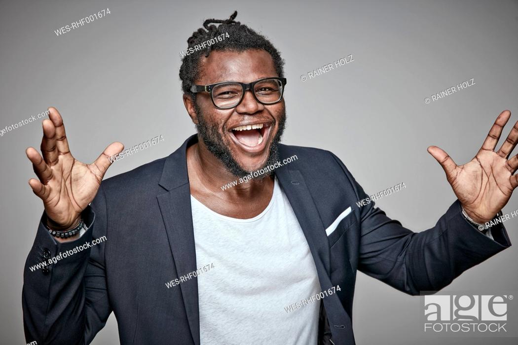 Stock Photo: Portrait of laughing man wearing glasses and jacket.