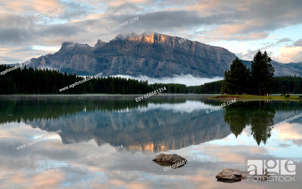 Stock Photo: Panoramic image of Mount Rundle reflecting in Two Jack Lake with early morning mood, Banff National Park, Alberta, Canada.