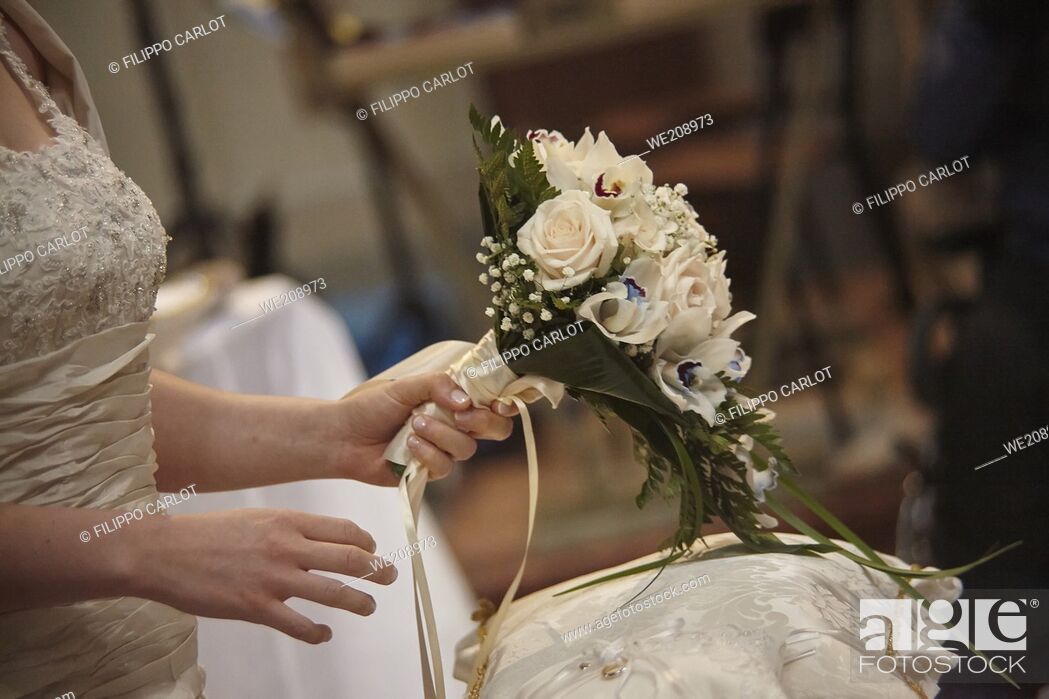 Stock Photo: Double bouquet held in the hands by the bride during the celebration of her marriage.