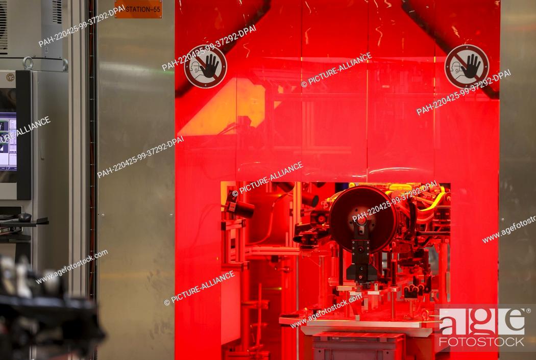 Stock Photo: 25 April 2022, Saxony, Meerane: An assembled rear axle with electric motor for a Volkswagen electric vehicle is measured fully automatically.