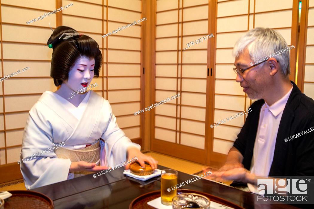 Stock Photo: Fukuyu, geisha playing with client in Miyaki tea house (o-chaia).Geisha's distric of Miyagawacho.Kyoto. Kansai, Japan.
