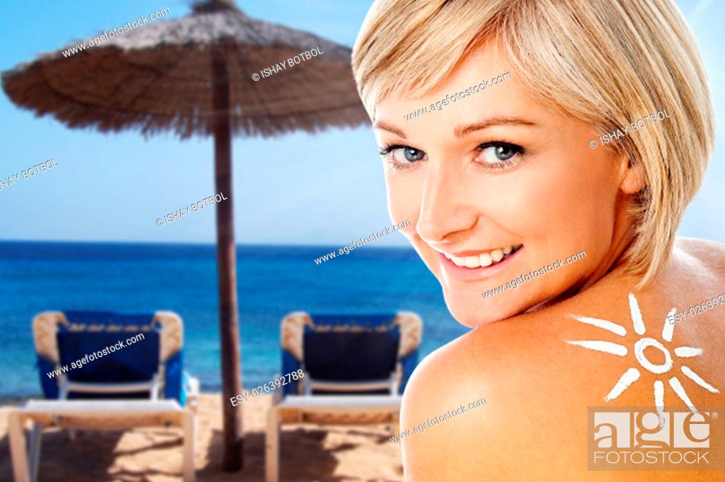 Stock Photo: Two chairs and an umbrella on the beach.