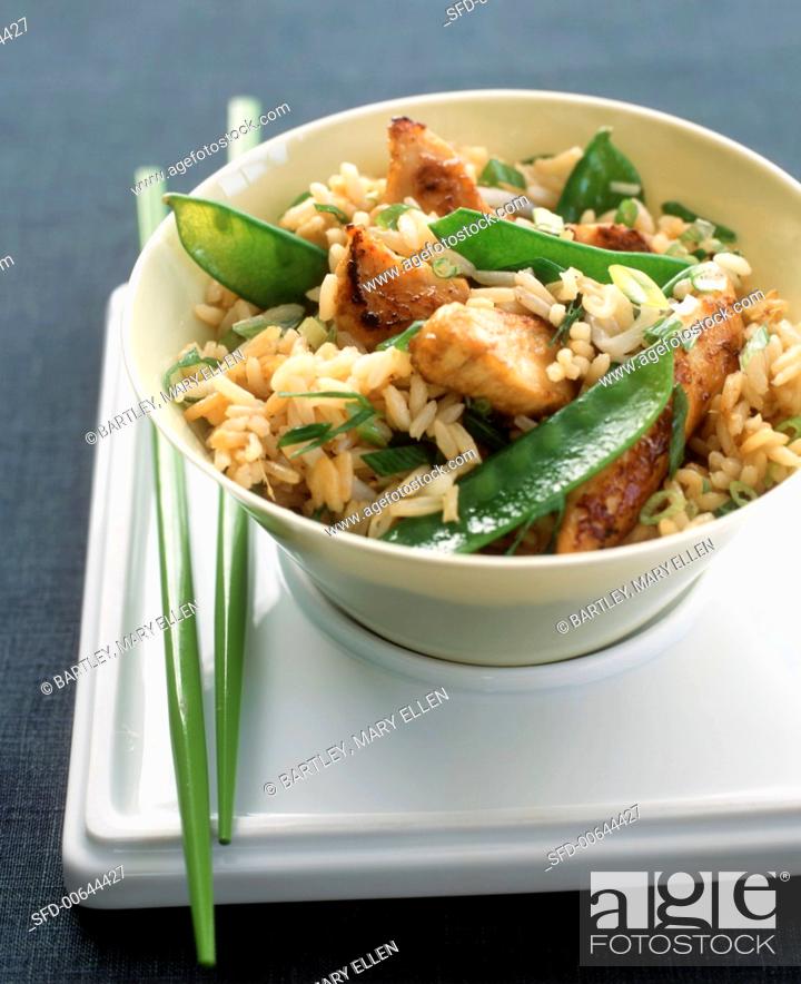 Stock Photo: Brown Rice with Chicken, Snow Peas and Scallions on a Tray with Chopsticks.