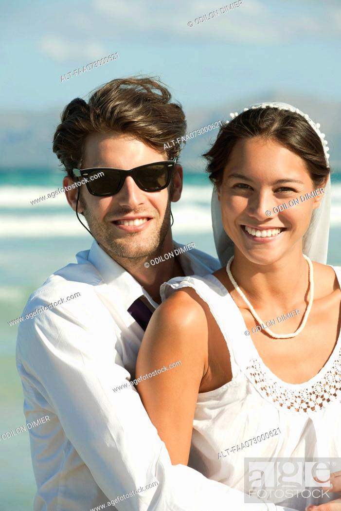 Photo de stock: Bride and groom at the beach, portrait.