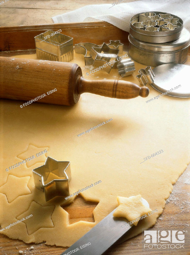 Stock Photo: Rolled-out Dough with Stars and Star Cutter.