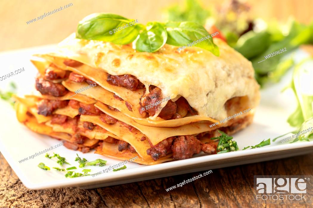 Stock Photo: closeup of a portion of lasagna.