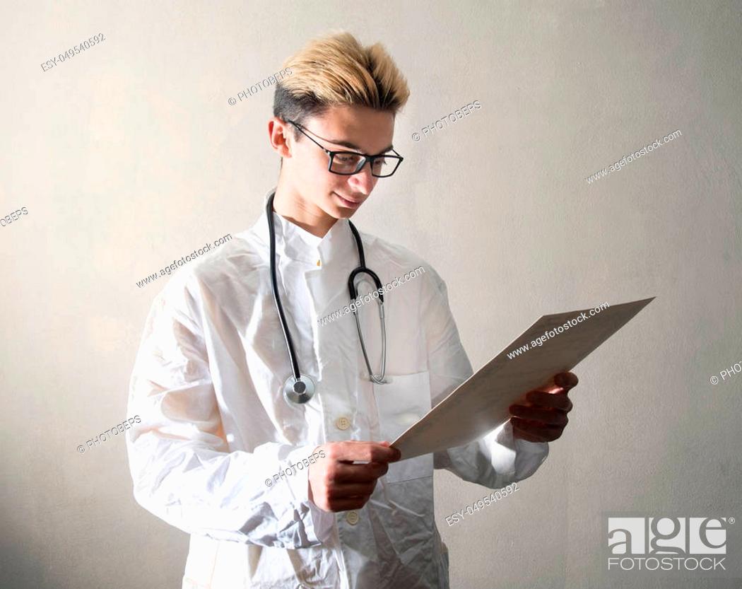 Stock Photo: a Young Doctor consult a medical briefcase.