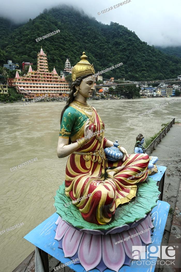 Stock Photo: Rishikesh, India - July 2021: Views of the Swarg Niwas Temple from the Sai Ghat in Rishikesh on July 20, 2021 in Uttarakhand, India.