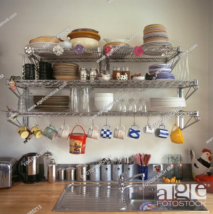 Crockery And Pans On Stainless Steel Storage Shelves Above Kitchen Sink Stock Photo Picture And Rights Managed Image Pic Foh U14285213 Agefotostock