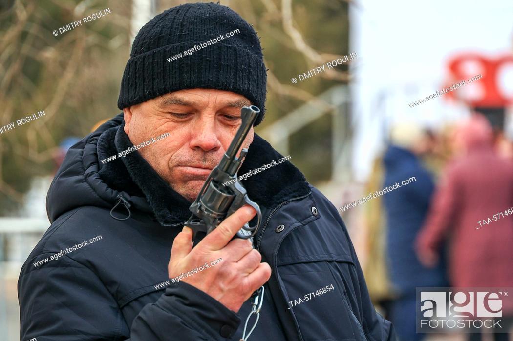 Stock Photo: RUSSIA, VOLGOGRAD - FEBRUARY 2, 2023: A man holds a pistol as he attends a historical reenactment during a celebration of the 80th anniversary of the victory in.