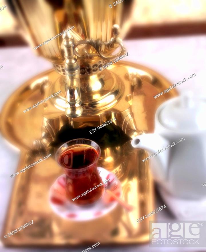 Stock Photo: close up shot of a samovar with teacup.