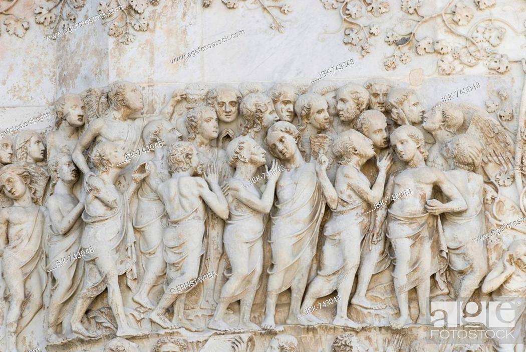 Stock Photo: Stone relief, west side of the cathedral in Orvieto, Umbria, Italy.