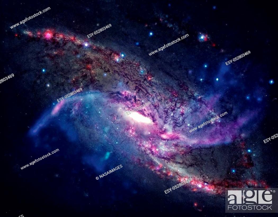 Stock Photo: Spiral galaxy M106. It located in the constellation Canes Venatici. NGC 4258 is a spiral galaxy like the Milky Way. Retouched colored image.