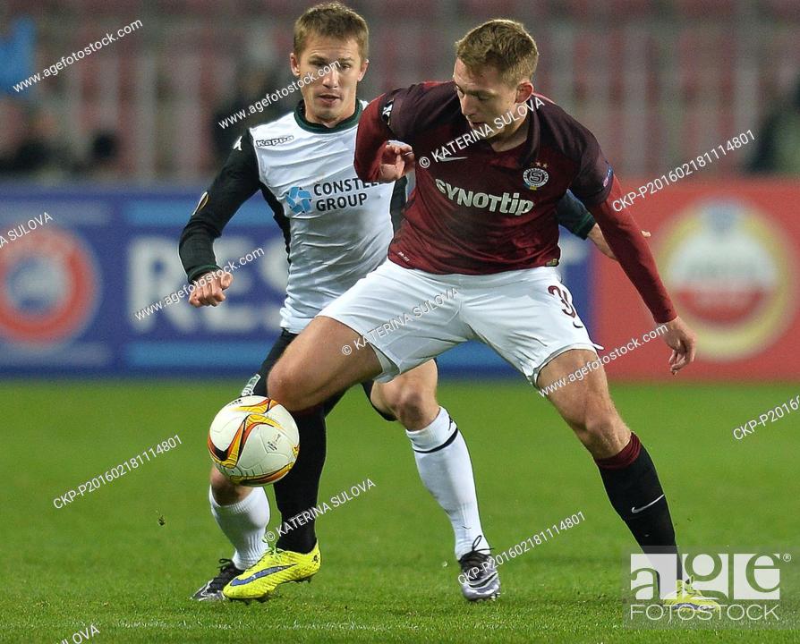 Stock Photo: Lukas Julis of Sparta Prague, right, challenges Vitaly Kaleshin of FK Krasnodar, left, during their Europa League soccer match in Prague, Thursday, Feb.