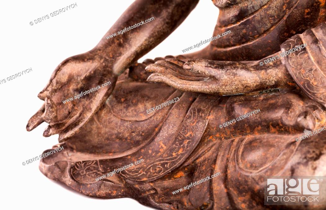 Stock Photo: Buddha Shakyamuni's figure in a blessing pose - varada mudra. The old statue made of metal isolated on a white background.