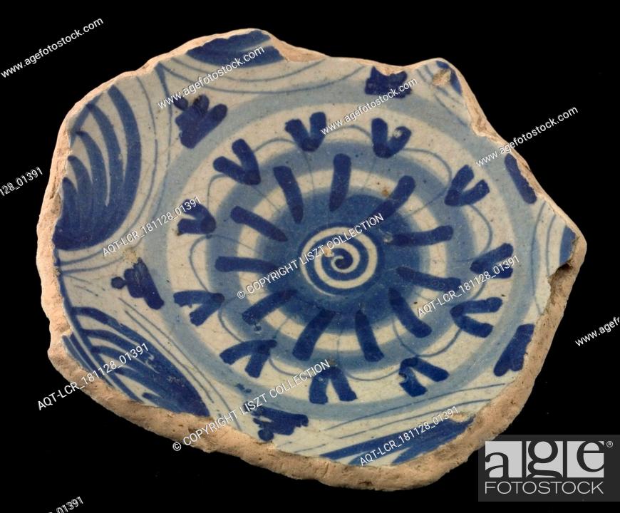 Stock Photo: Fragment majolica dish or bowl, blue on white, with rosette in the middle, dish plate bowl crockery holder soil find ceramic earthenware glaze.